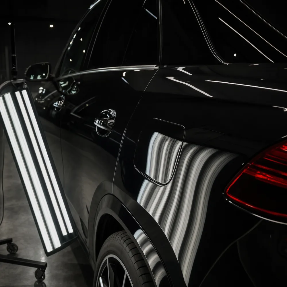 The same style of panel after paint correction, mirror clean under the inspection light