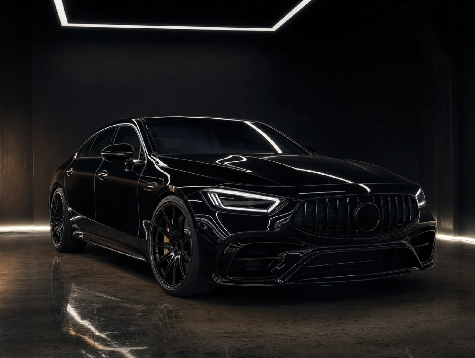 A vehicle staged in the dark studio bay at Mirror Finish Detail Co., reflections sharp under controlled light